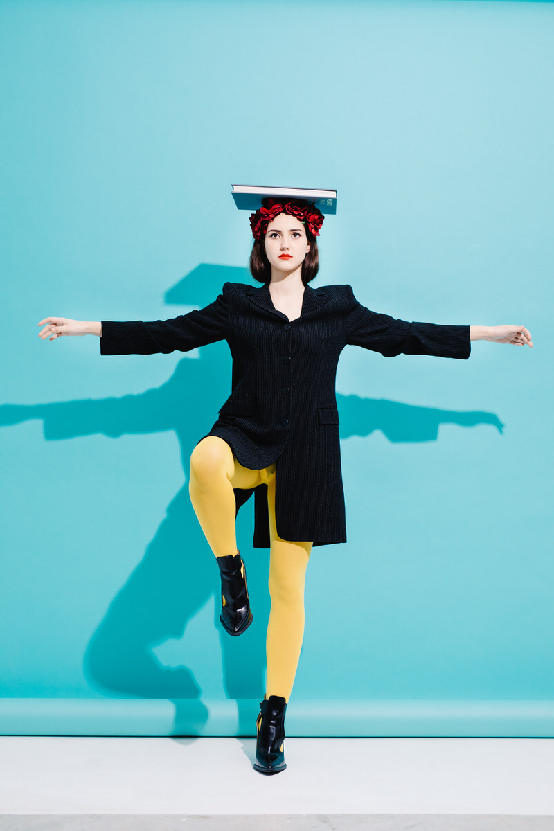 Woman balancing with book on head